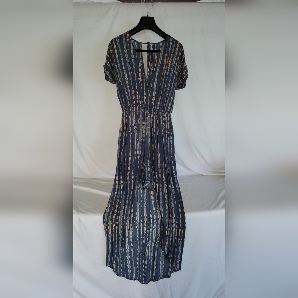 One peace romper,  shorts in front and long dress on the back.  Very stylish.